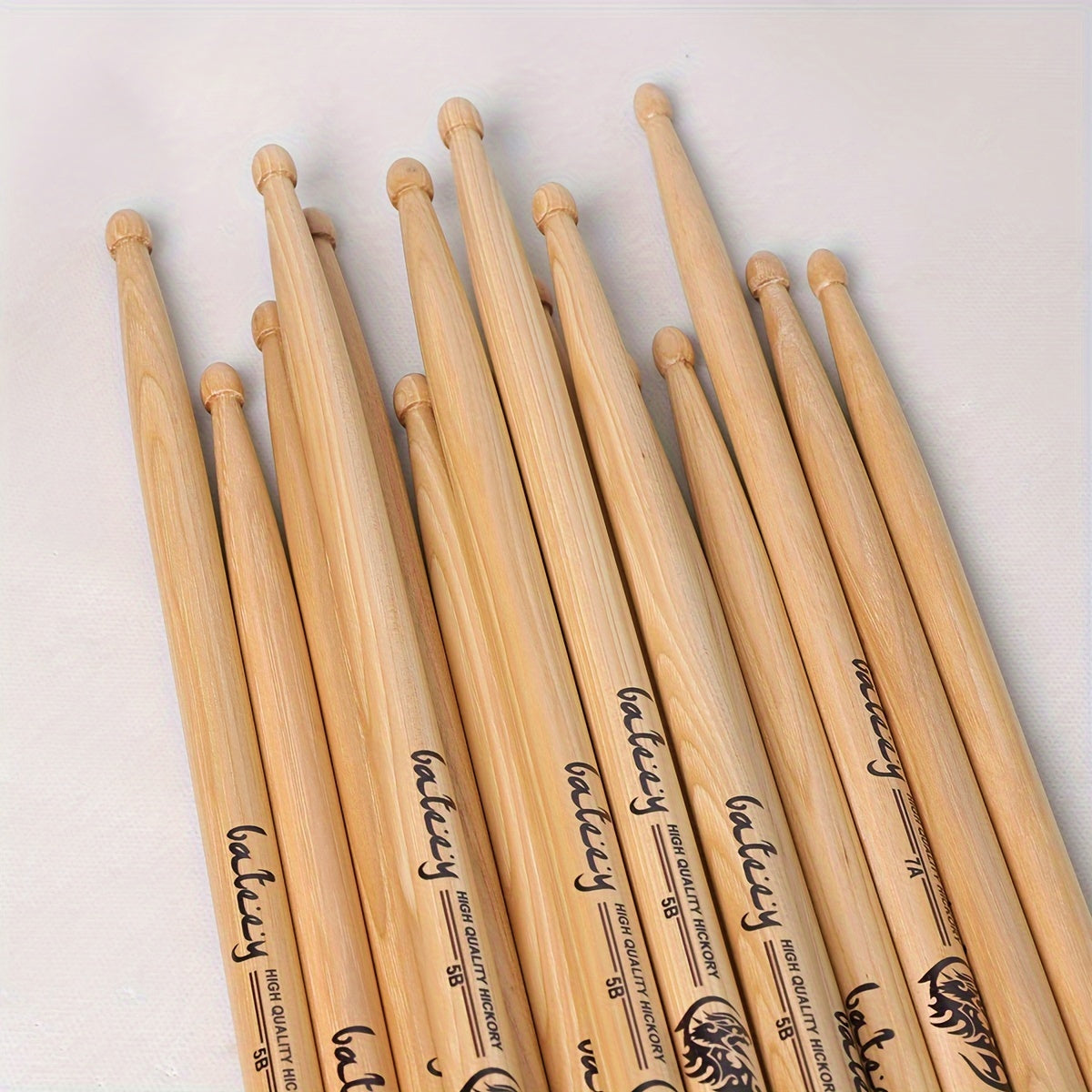 North American walnut drumsticks available in 5A, 5B, and 7A models for performance and practice.