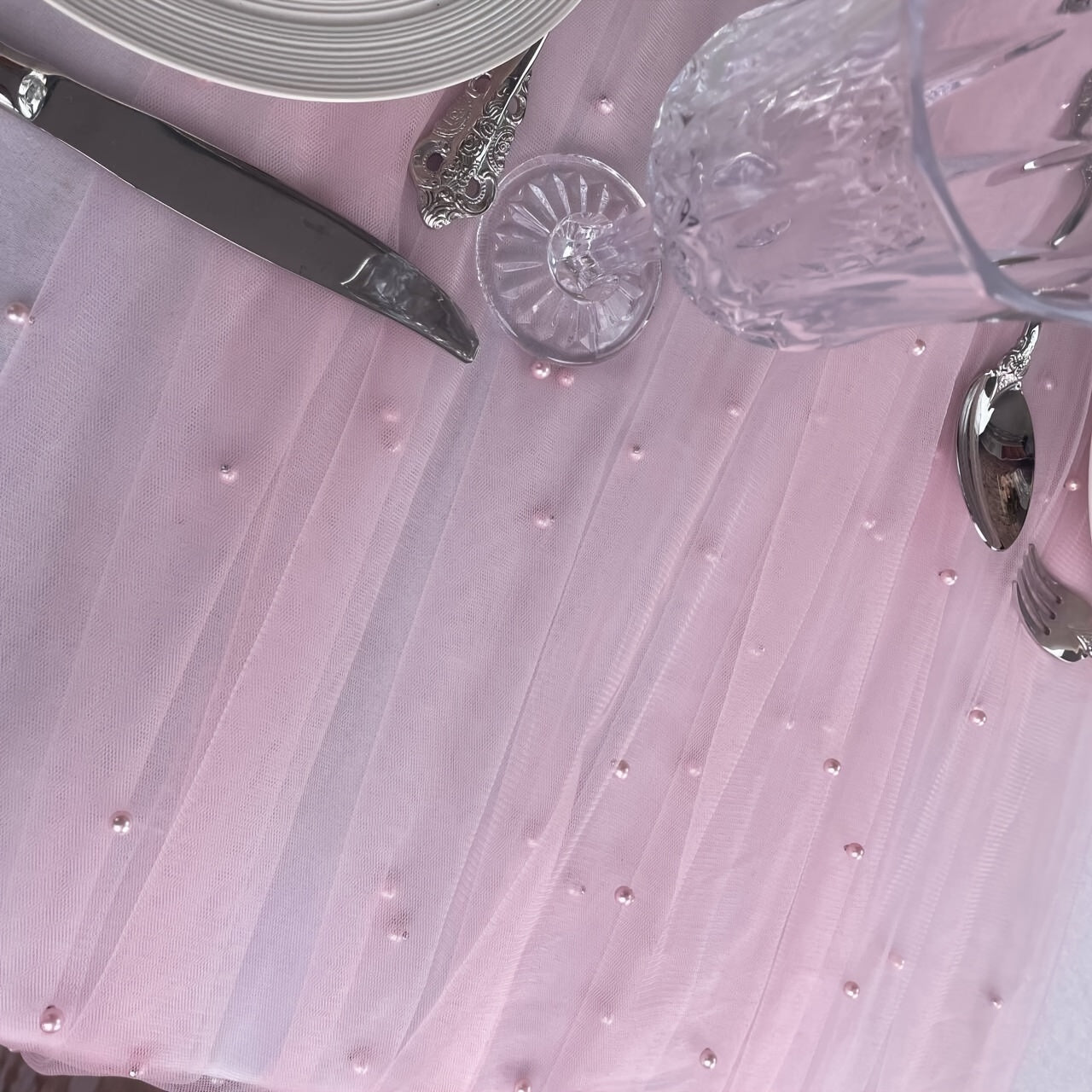 Elegant pearl bead tulle table runner, perfect for weddings and parties. Can also be used as a chair sash or backdrop drape. Made from 100% polyester fabric with delicate bead detailing.