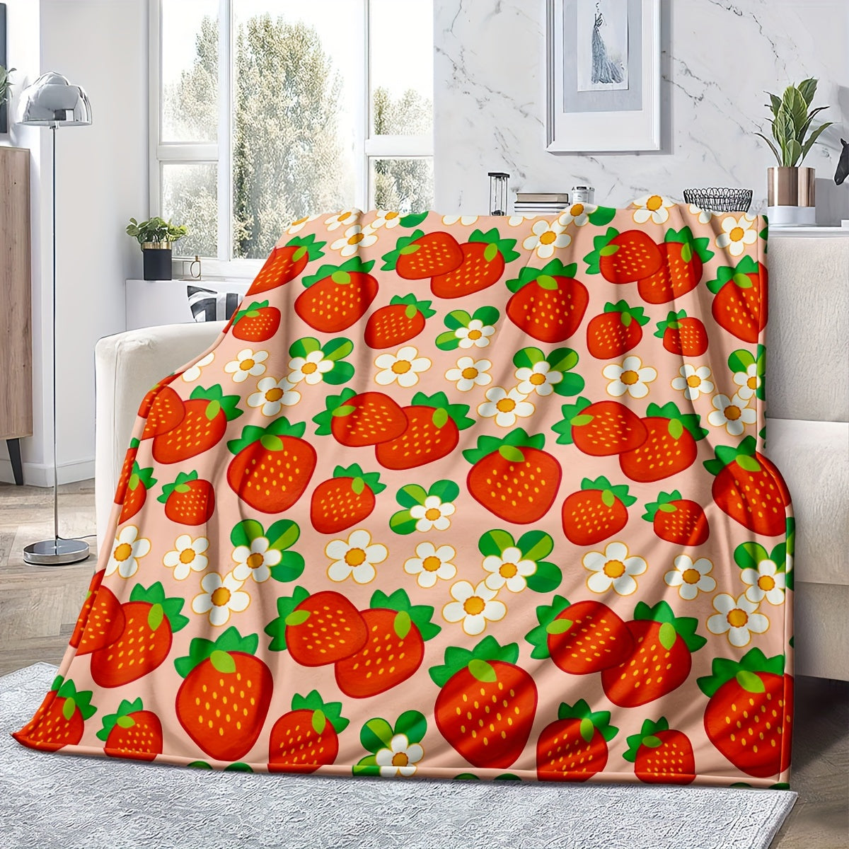 One piece of a cozy, all-season microfiber throw blanket in a rustic style, featuring a charming strawberry and flower pattern. This woven fruit-themed gift blanket is perfect for women.