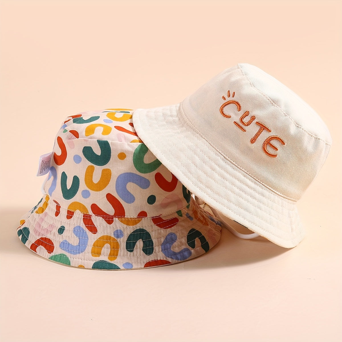 Stylish fisherman hat with cute letter embroidery, wide brim and drawstrings for sun protection and outdoor activities. Ideal for boys and girls in beach parties or traveling.