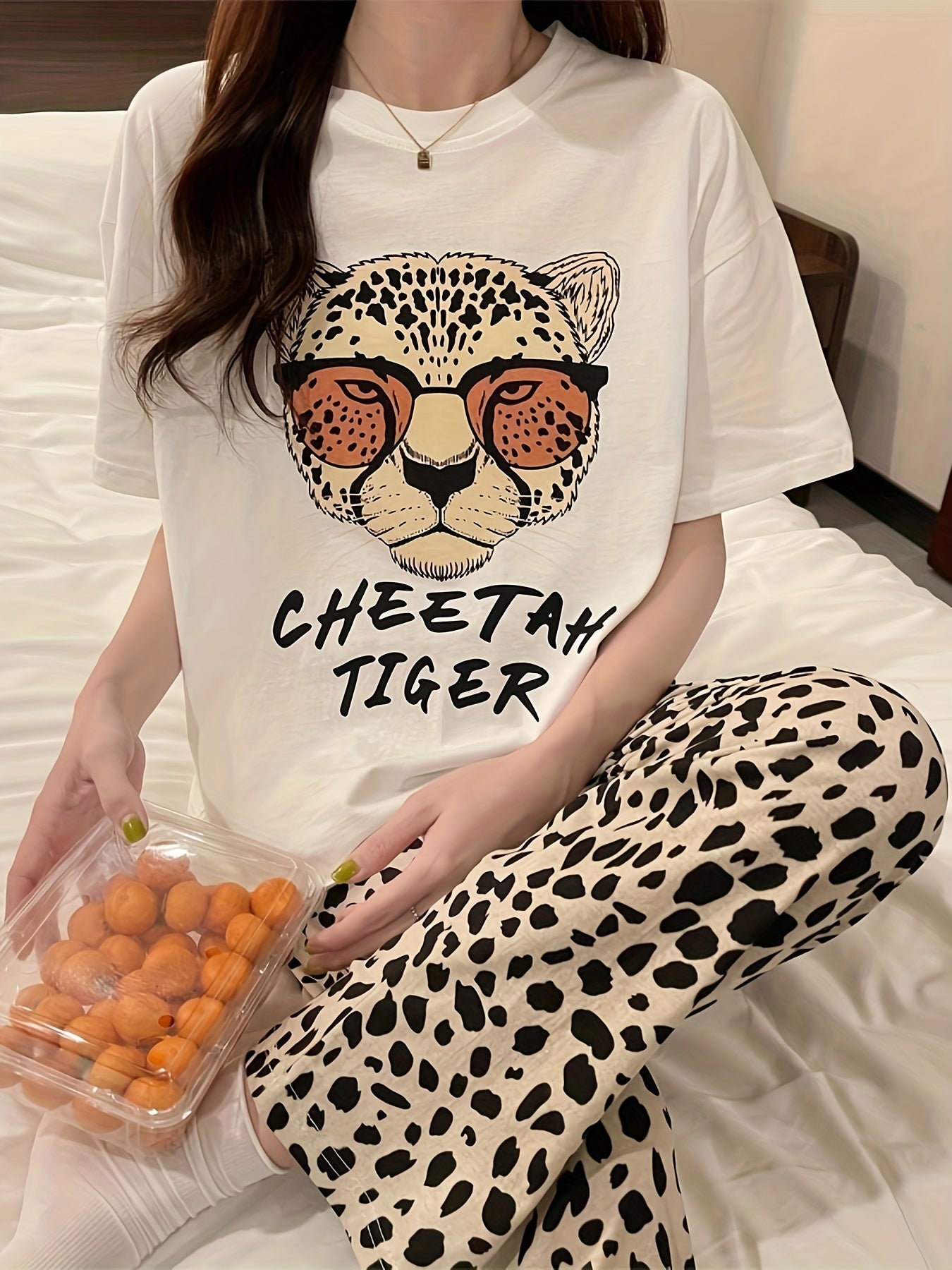 Casual pajama set for women with leopard and letter print, featuring a short sleeve top and matching pants for a comfortable fit.