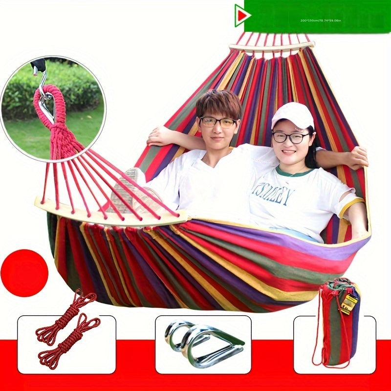 Heavy-duty rainbow canvas hammock for single or double with curved wooden sticks and a weight capacity of 226.8 KG. Includes tree straps for camping, backyard, or patio. High-strength