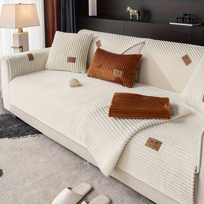 Luxurious plush sofa cover with label, thick and warm for winter. Pet-friendly, non-slip, modern design for living room, bedroom, or office decor.