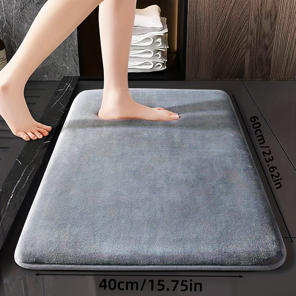 Soft and durable polyester bathroom mat with geometric design, ideal for shower, bathtub, bedroom, and living room. Versatile and non-slip, it is highly absorbent and machine washable.