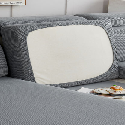 Durable sofa cover protects furniture from spills and stains.