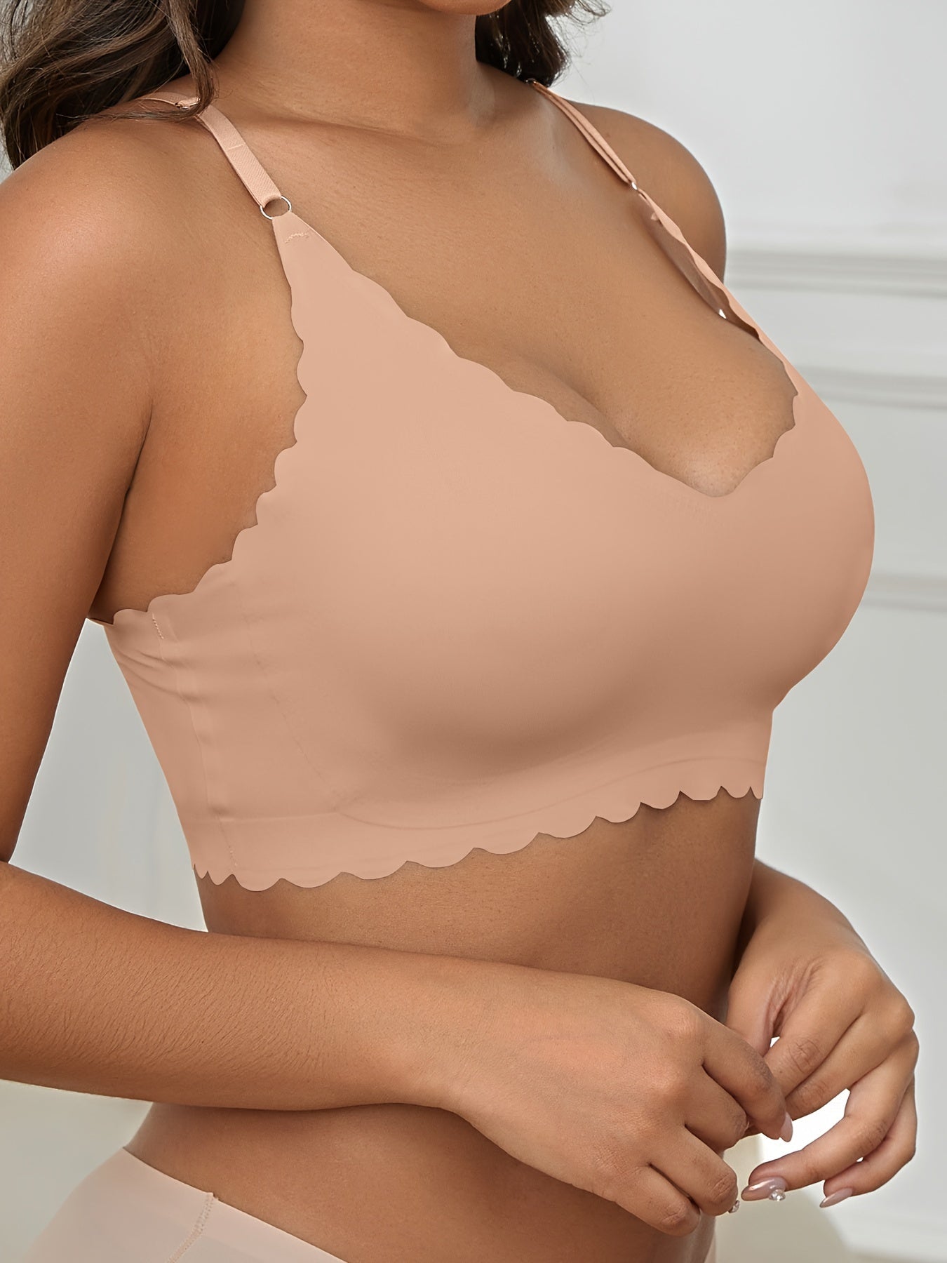 Seamless wireless bra for plus-size women with high elasticity and removable padding, in v-neck solid color.