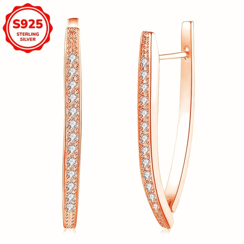 S925 Silver geometrically irregular triangle ear buckle, inlaid with zirconia stones in a single row. This luxurious and fashionable piece is adorned with precious stones, adding a touch of elegance to any outfit.