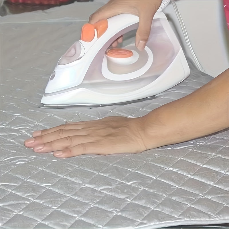 A non-electric silver-coated laundry pad that is heat resistant and portable, featuring thick cotton padding. This ironing mat can be used for dryer, washer, travel, hotel, and dorm use. It is a multipurpose accessory for ironing, and comes in a set of 1