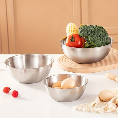 Set of 3 stainless steel mixing bowls with measurement marks, ideal for cooking and baking in kitchens and restaurants.