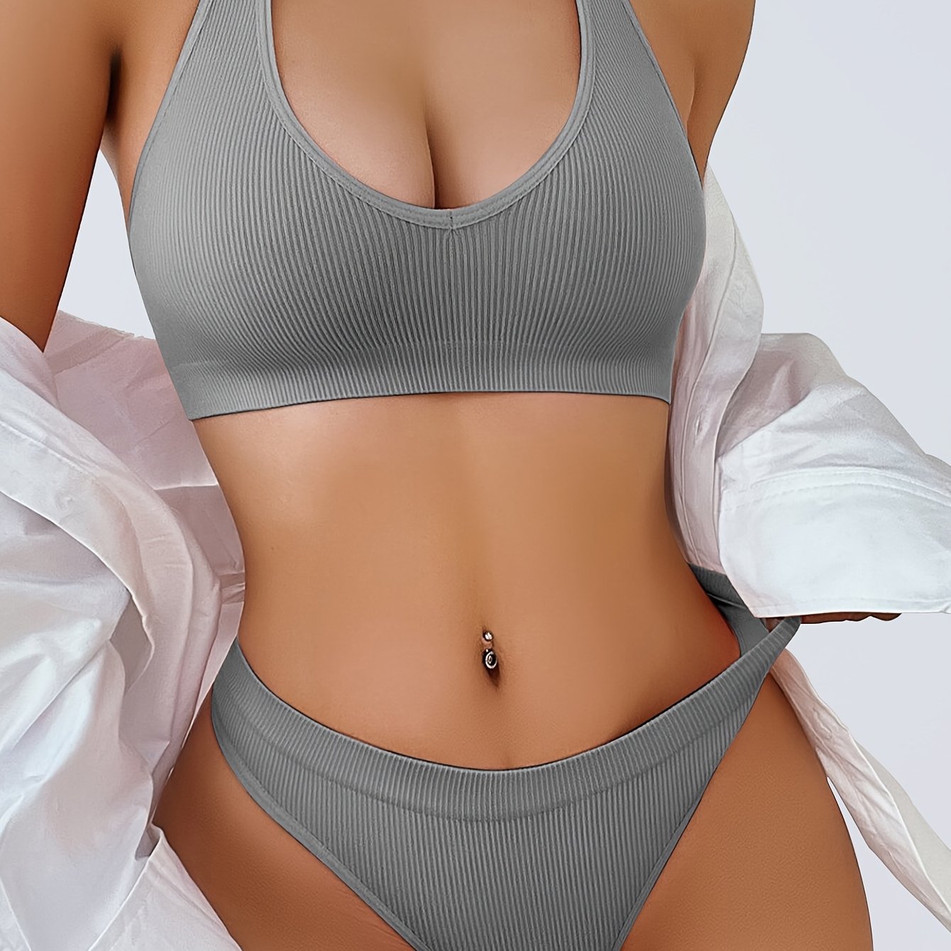 Two-piece women's camisole bra and panty set in solid color, made from knitted fabric with slight stretch. Comfortable and breathable sportswear with bra pads in the top.