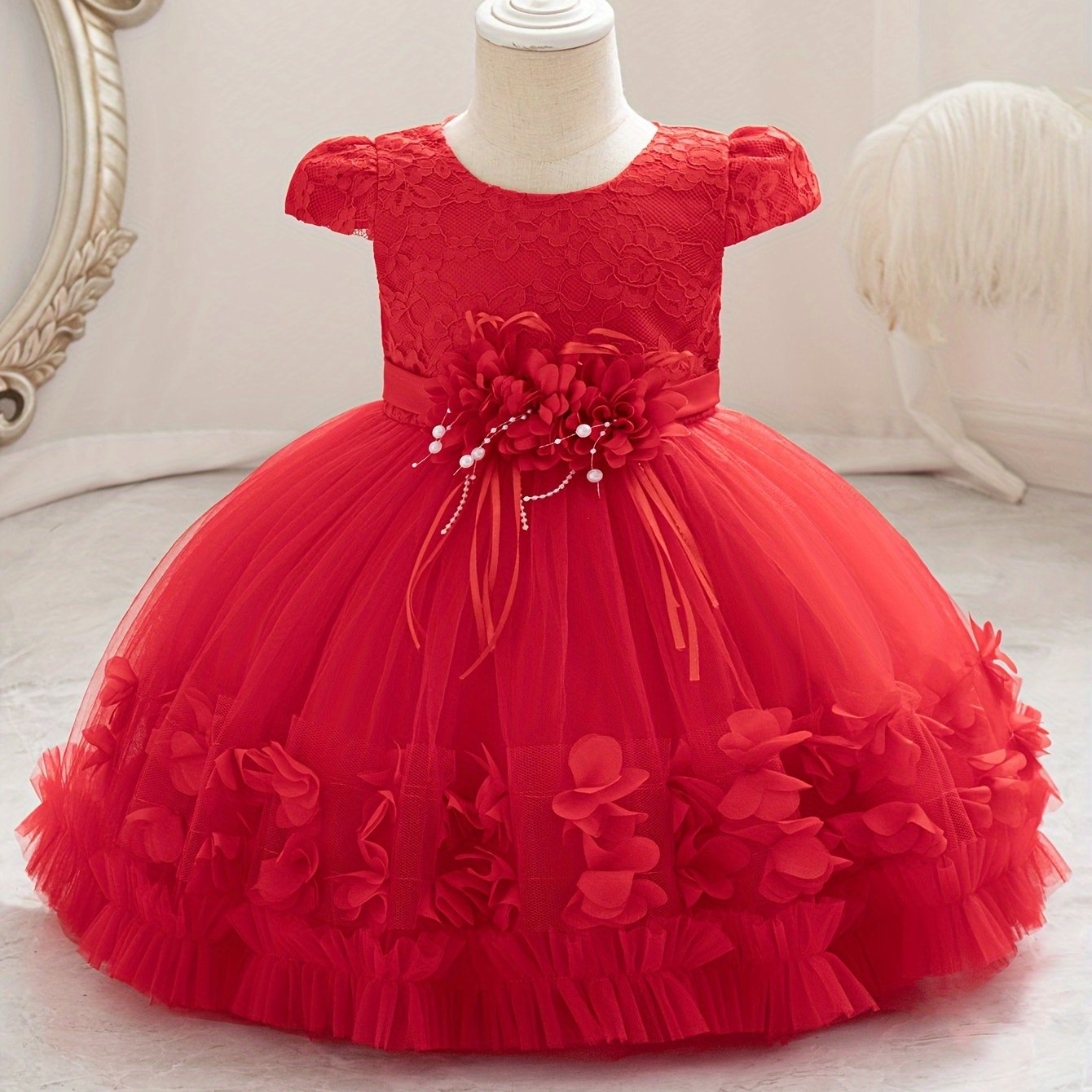 Baby's floral tulle princess dress with lace sleeves for formal occasions.