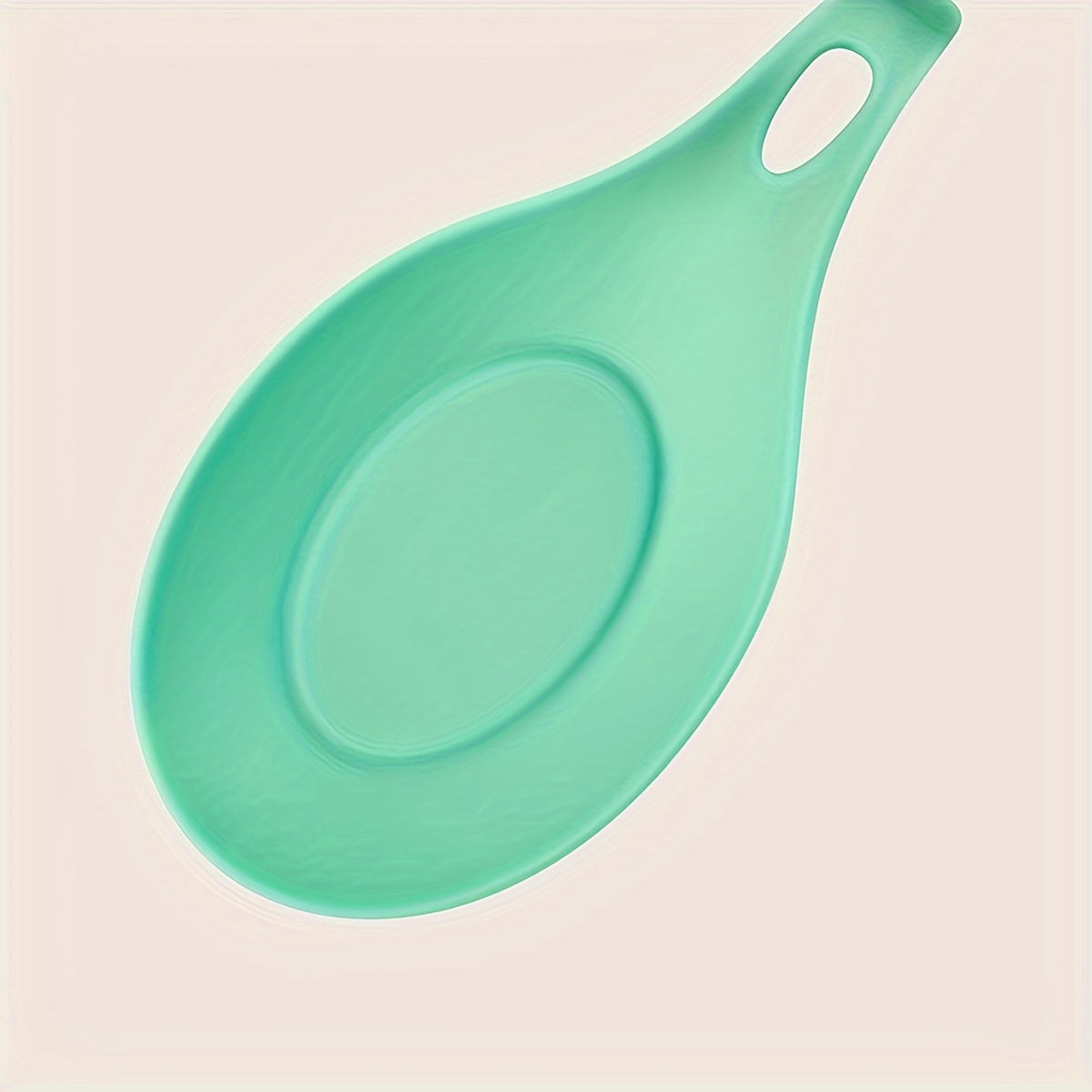 Durable, non-slip silicone spoon pad for kitchen utensils, heat-resistant and easy to clean.