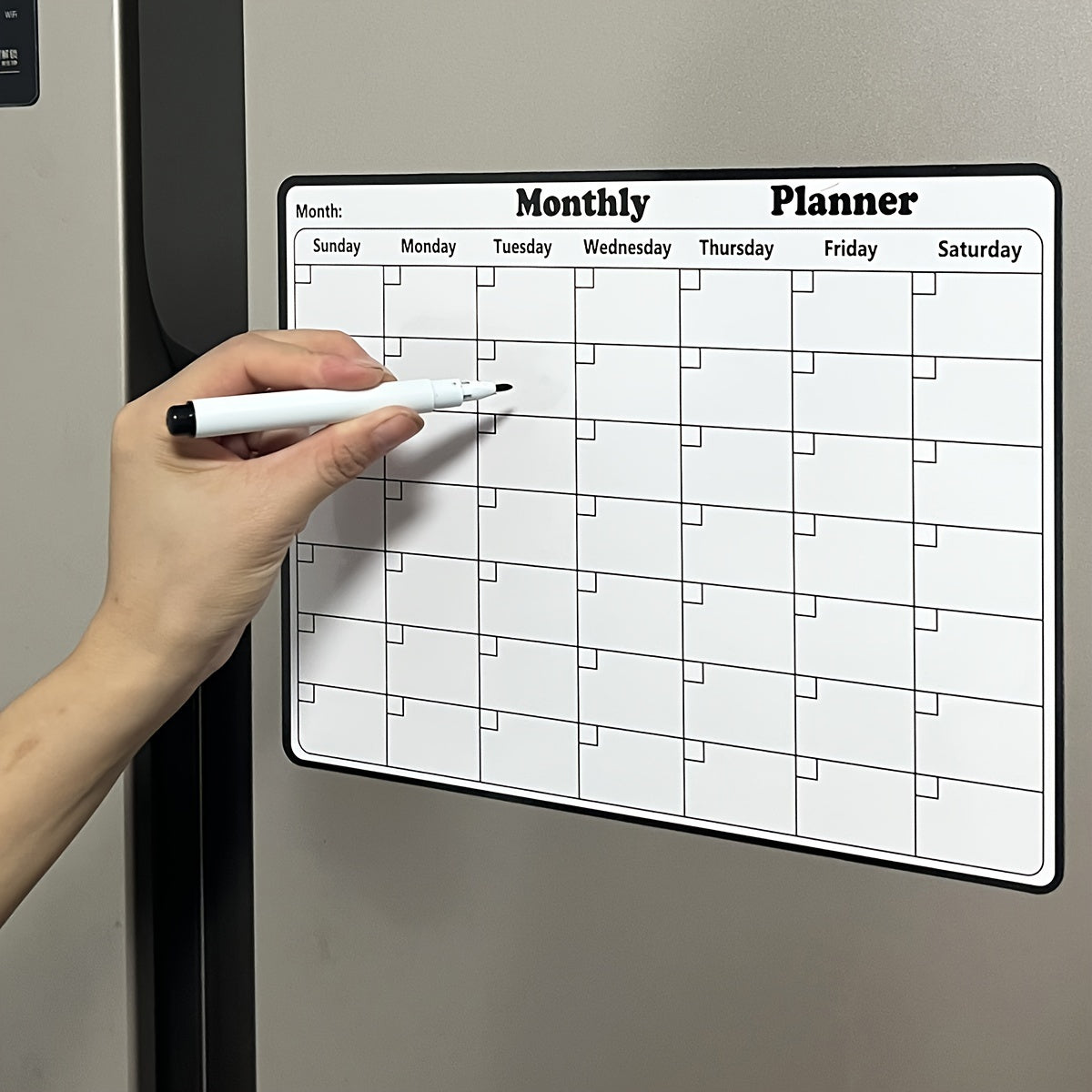 One piece of a dry erase fridge magnetic calendar, featuring a white board design perfect for refrigerators. This magnetic calendar is great for keeping track of appointments and events in the kitchen, serving as a decorative and functional addition to