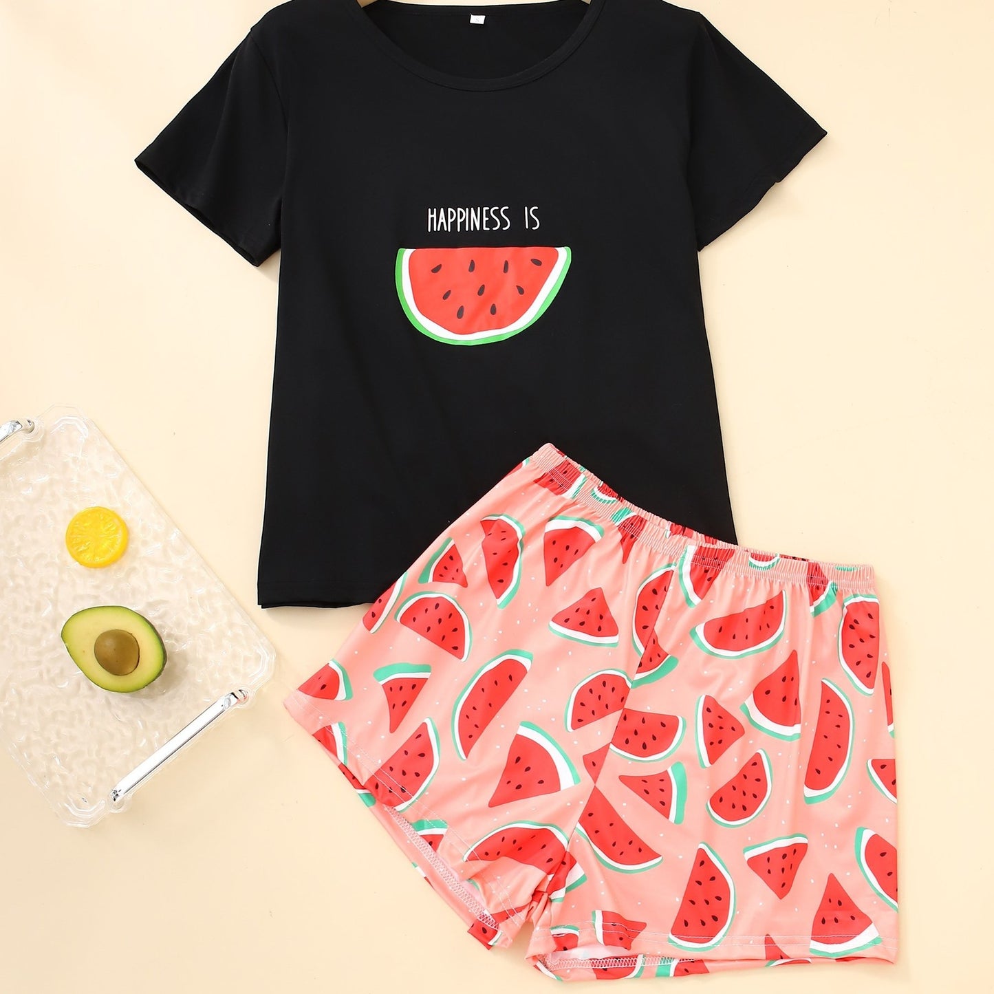 Women's loungewear set with watermelon and letter print, including short sleeve top and elastic shorts.