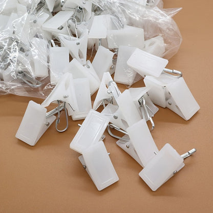 This 20-piece set of white plastic clothespins is ideal for hanging curtains, bathrobes, and other items. Please note that these clothespins should be hand washed only.