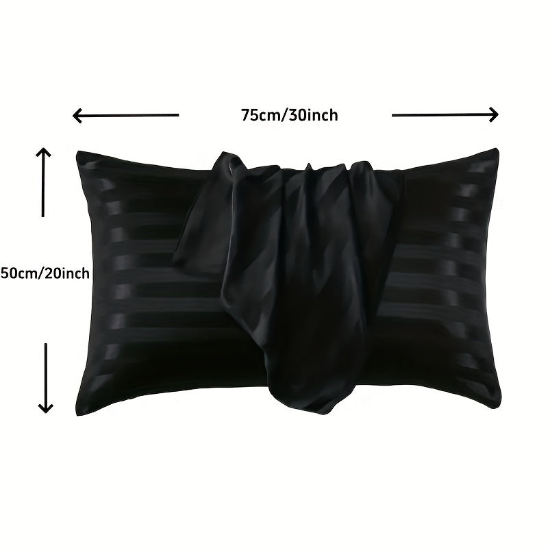 Black pillow cover for bed made of hypoallergenic polyester with a satin stripe design. Machine washable and wrinkle resistant.