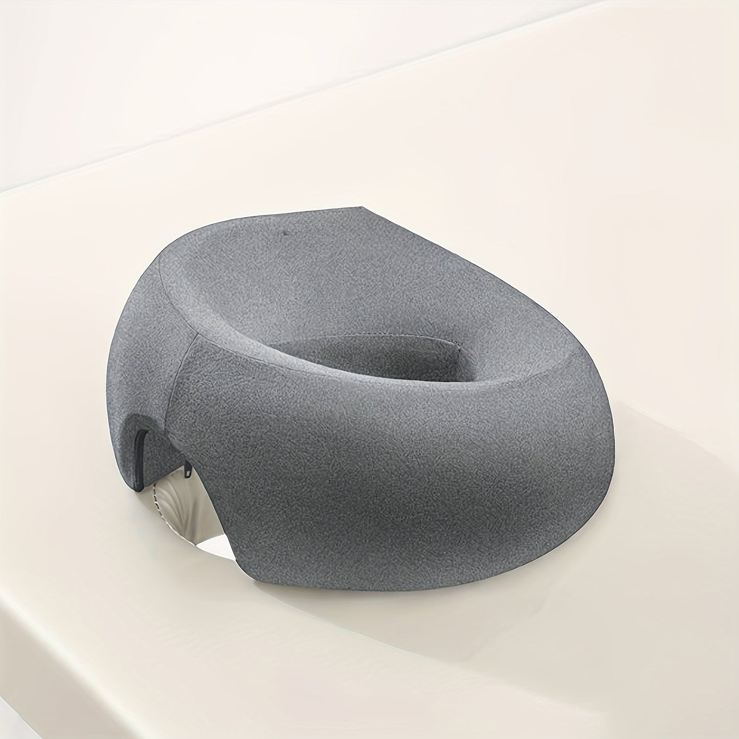 The Modern U-Shaped Memory Foam Face Pillow is a luxurious spa massage cushion that can be hand washed. It comes with a soft polyester cover, knitted fabric, and polyurethane filling for ultimate comfort. The zipper closure allows for easy removal and