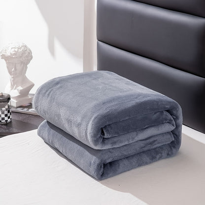 A cozy, grey flannel blanket is the perfect gift for any occasion. This soft and warm throw blanket is ideal for snuggling up on the sofa, staying warm in the office, or keeping cozy on a camping trip. It's a versatile gift that can be used all year