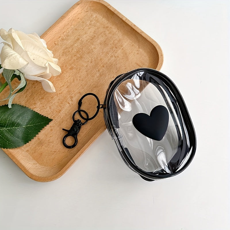 Waterproof heart-shaped PVC bag with keychain for organizing cables and headphones.