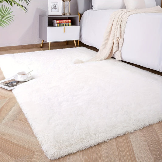 Soft and luxurious pure white plush area rug, ideal for bedroom, living room, and dorm décor. Made from machine washable polyester for easy care.