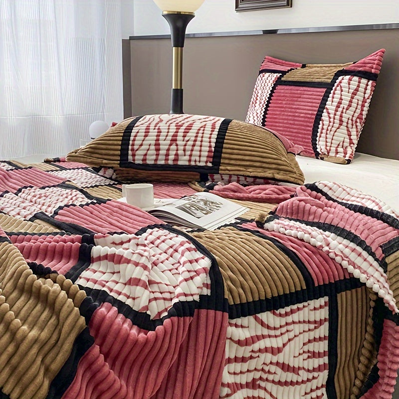 A plaid-patterned blanket that serves multiple functions in the home, including as a sofa throw.