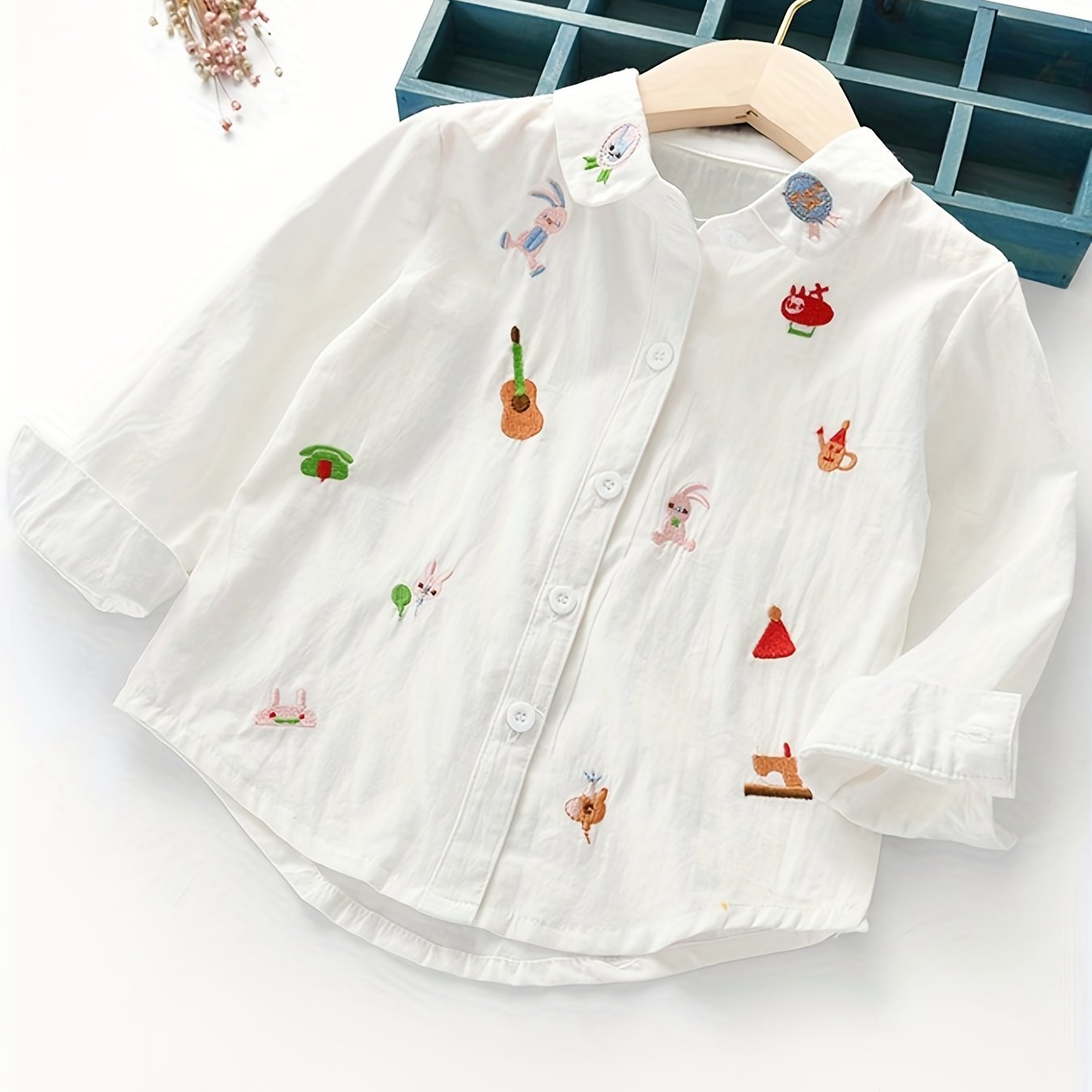 Charming girls' cotton shirt with embroidered long sleeves, cartoon collar, ruffled cuff & hem. Perfect for spring/fall, lightweight and breathable.