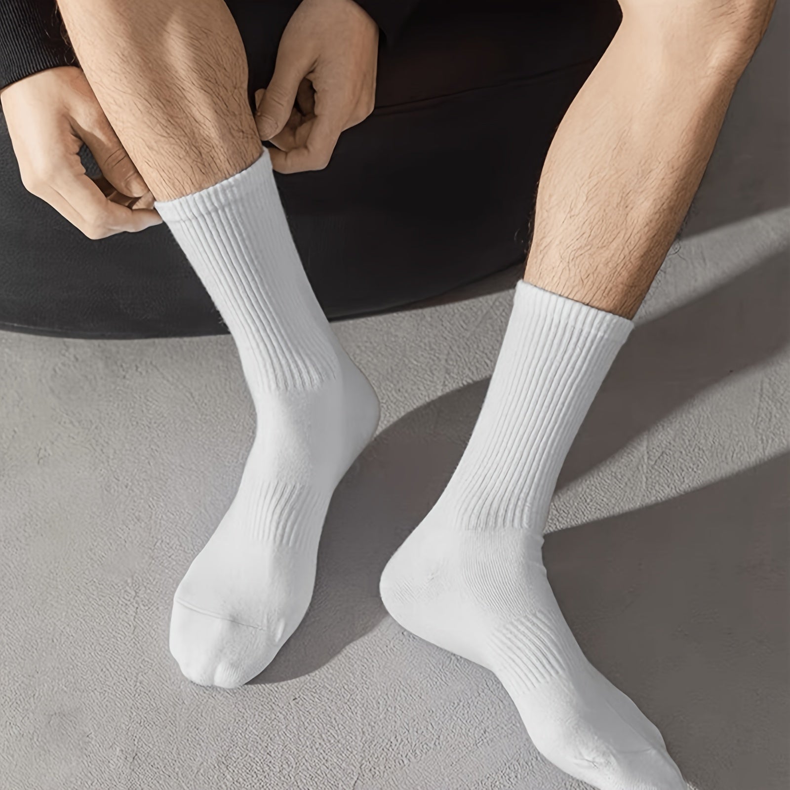 20 Pairs of solid color, mid-calf unisex socks made of 100% polyester. Comfortable soft knit fabric. Machine washable. Lightweight at 89 gsm, ideal for layering.