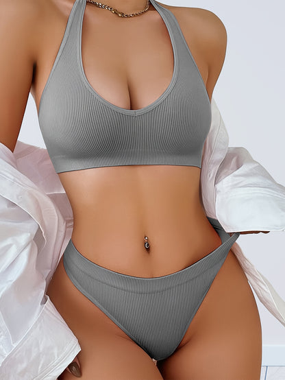 Two-piece women's camisole bra and panty set in solid color, made from knitted fabric with slight stretch. Comfortable and breathable sportswear with bra pads in the top.