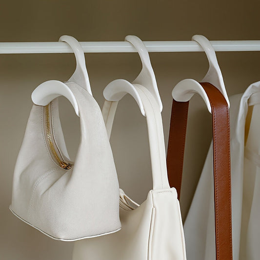 Smart Closet Organizer comes in either a 7-piece or 13-piece set. These portable plastic purse hangers are perfect for organizing bags, hats, and scarves. The space-saving handbag hooks can be used in wardrobes or display racks.