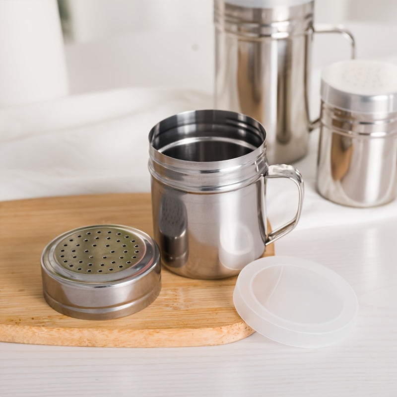 Durable stainless steel seasoning jar with handle perfect for BBQ spice, pepper, and sesame powder. Ideal for home, restaurant, or café use. Modern design and practical spice container.