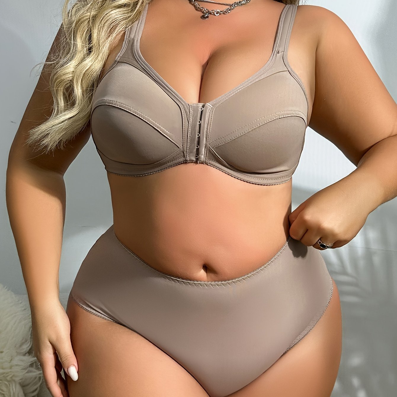 Front closure bra and panties set made of seamless, soft nylon blend for plus sizes. Solid color with stretch fit.