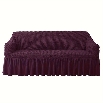 Non-slip elastic sofa cover with skirt for home decor.