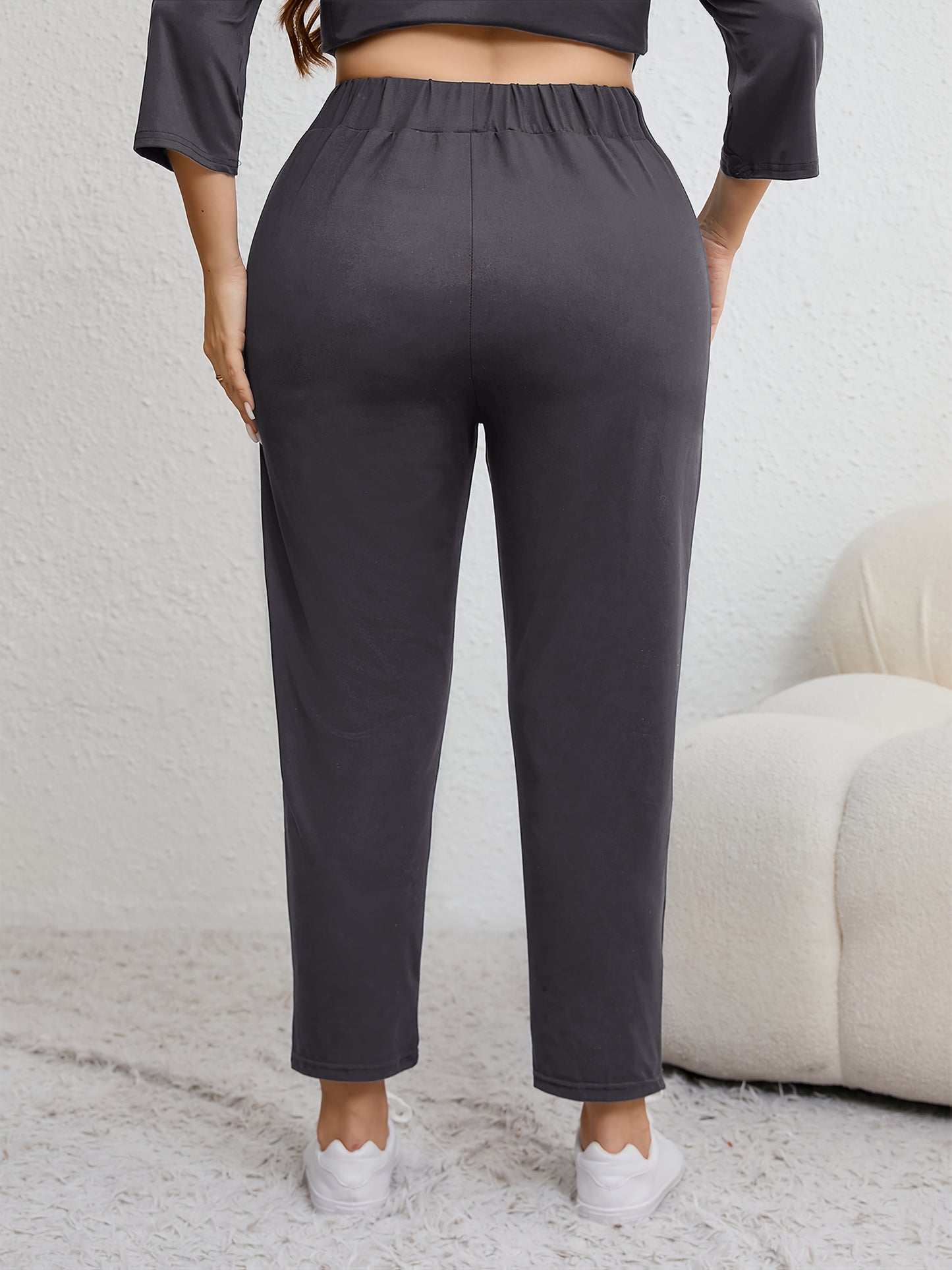 Plus size women's harem pants with high elasticity, ruched waist, pockets, and versatile for all seasons.