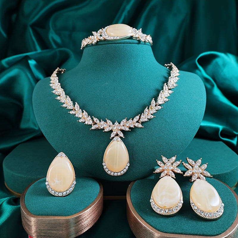 Experience luxury with our 18K Gold Plated Alloy Jewelry Set adorned with sparkling rhinestones. This 4-piece set oozes elegance and is perfect for your vacation outfits. Ideal for weddings, gifts, and Valentine's Day, our Gold Plated Bridal Party Sets