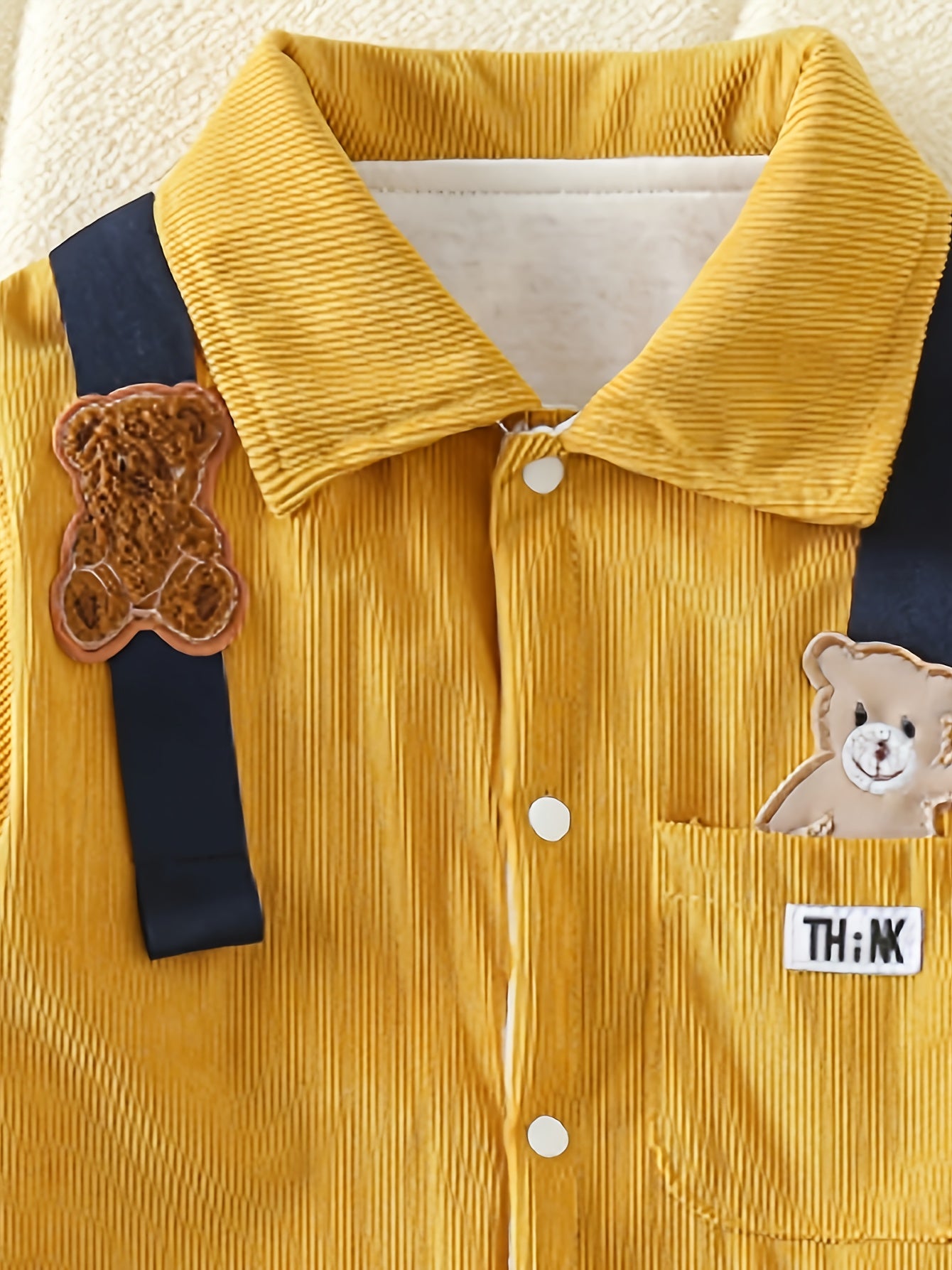 Mustard yellow bear patchwork romper with striped straps for baby boys is made of 100% polyester and has a casual style, perfect for spring/fall and outdoor activities.