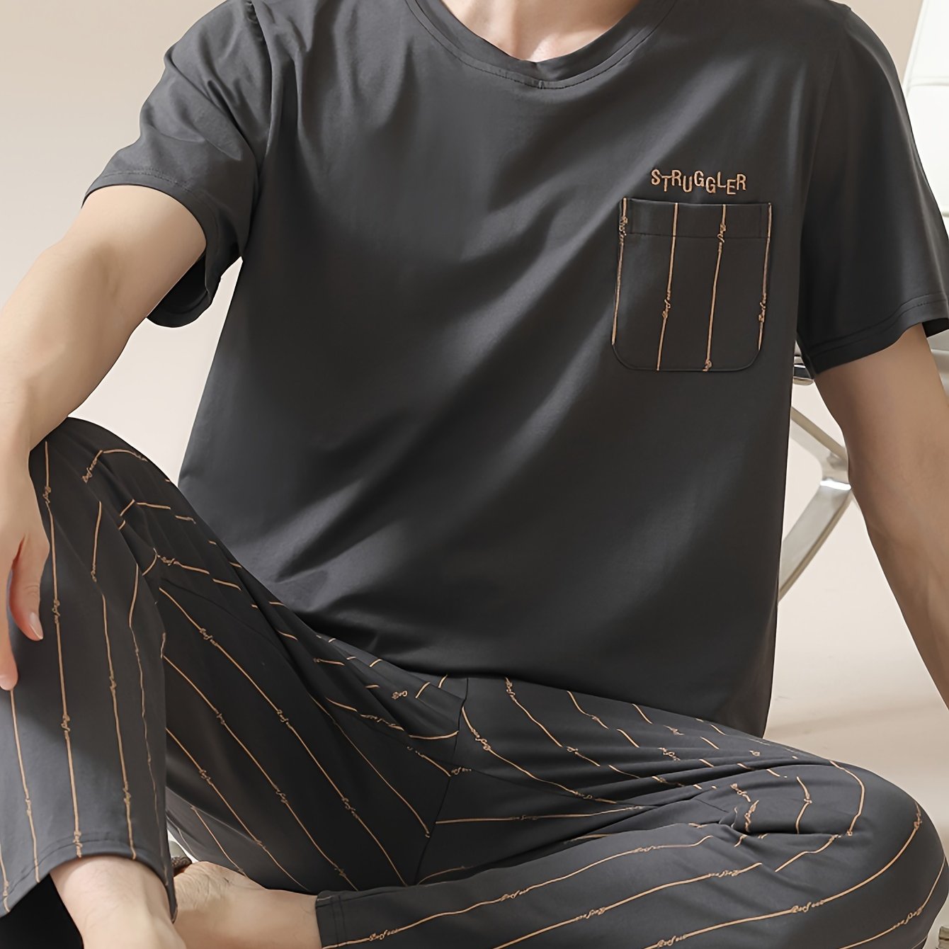 Men's 2-piece simple pocket round neck short sleeve pajama set with striped trousers. Comfortable and skin-friendly for cozy loungewear.