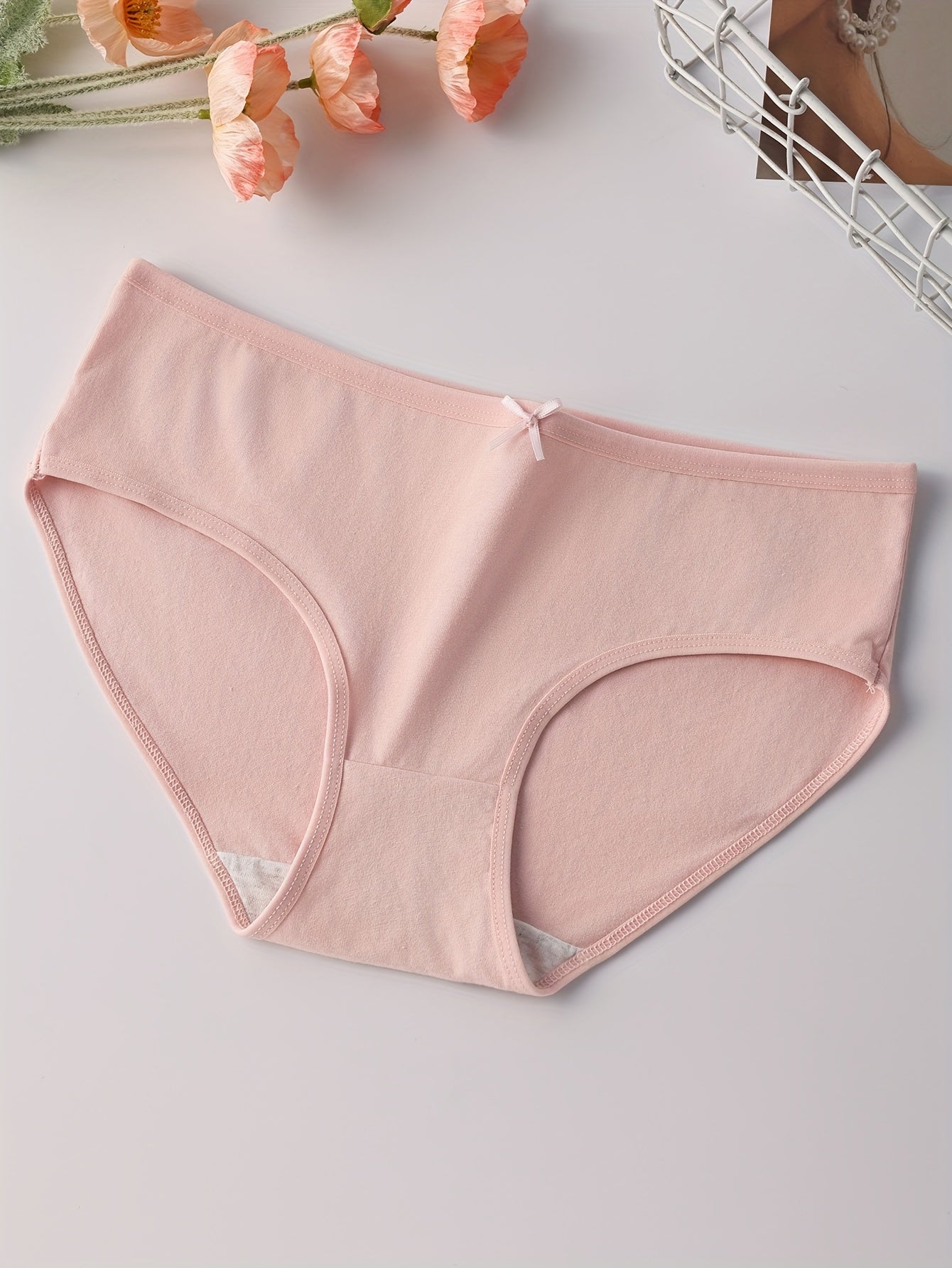 4 soft women's briefs with low rise, cute bow detail, comfortable fit, breathable and stretchy.