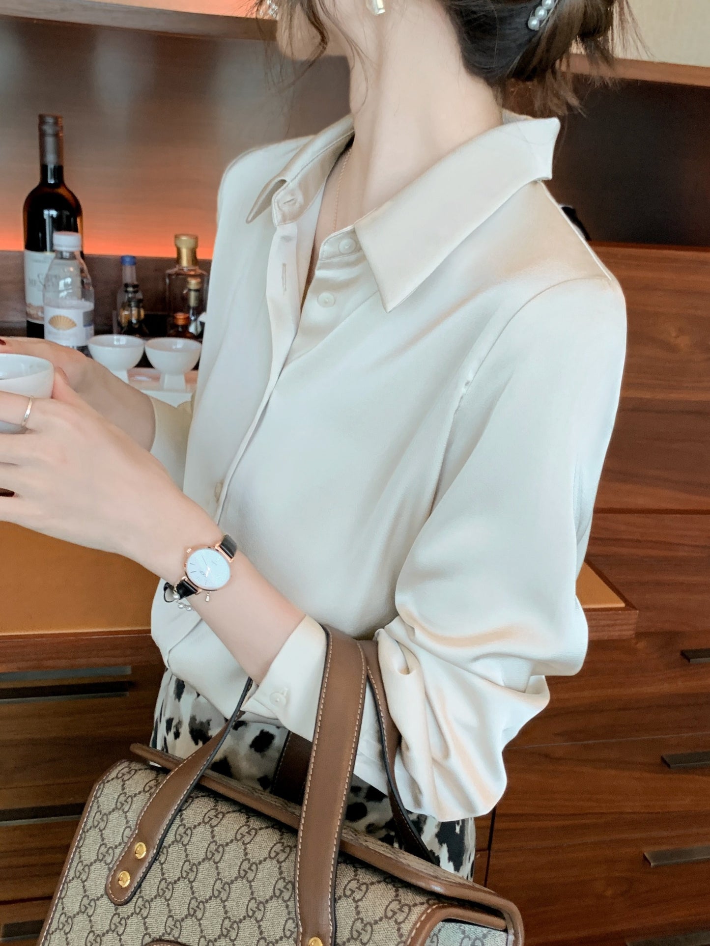 Women's chic solid color long sleeve blouse made of 100% polyester with lapel collar and button details. Suitable for all seasons.