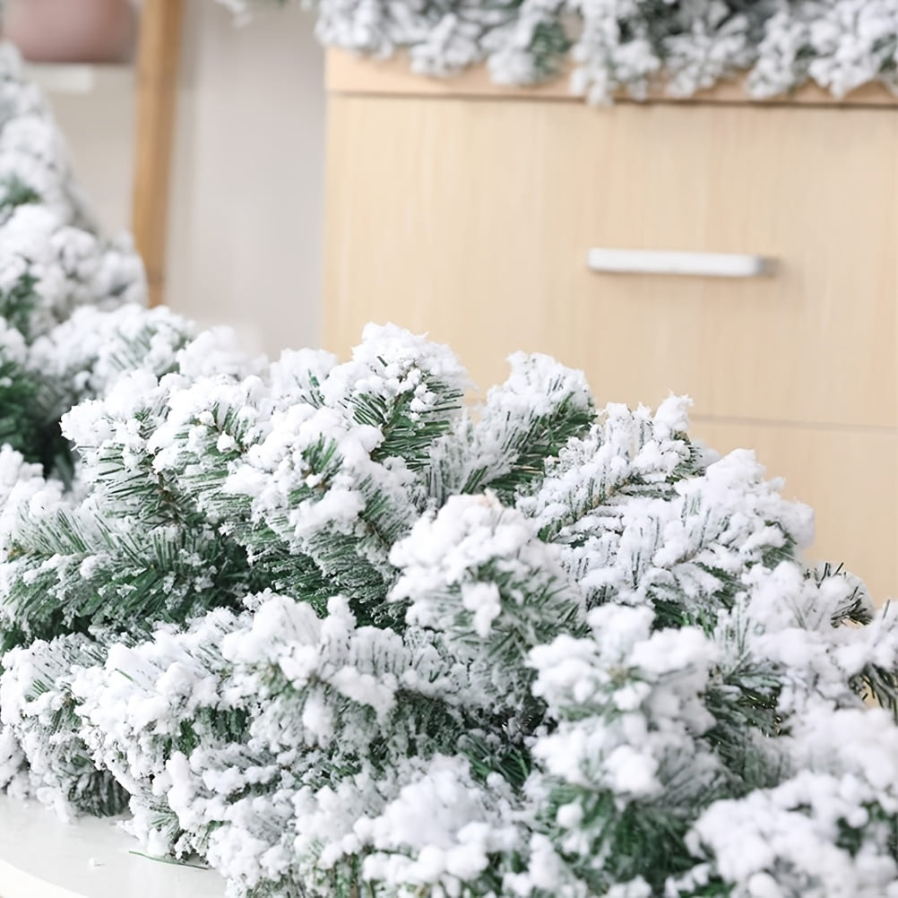 Snow flocked Christmas garland measuring 274.32cm, perfect for Xmas tree, stairs, and fireplace decor.