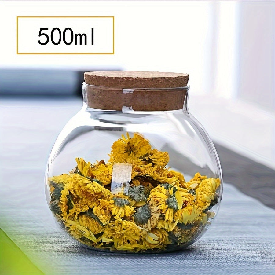 This glass storage jar with cork lid holds 16.9oz and is perfect for storing various items in your kitchen. Made of BPA-free and heat-resistant materials, it is a versatile canister that can be used for storing coffee beans, tea, flour, sugar, and more.