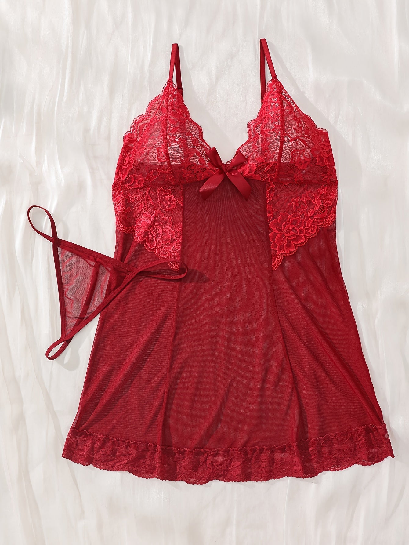 Women's sexy lingerie set features elegant sheer lace and mesh babydoll nightgown with floral detailing, V-neck, ruffled slip dress. Made of a polyester blend with lace accents.