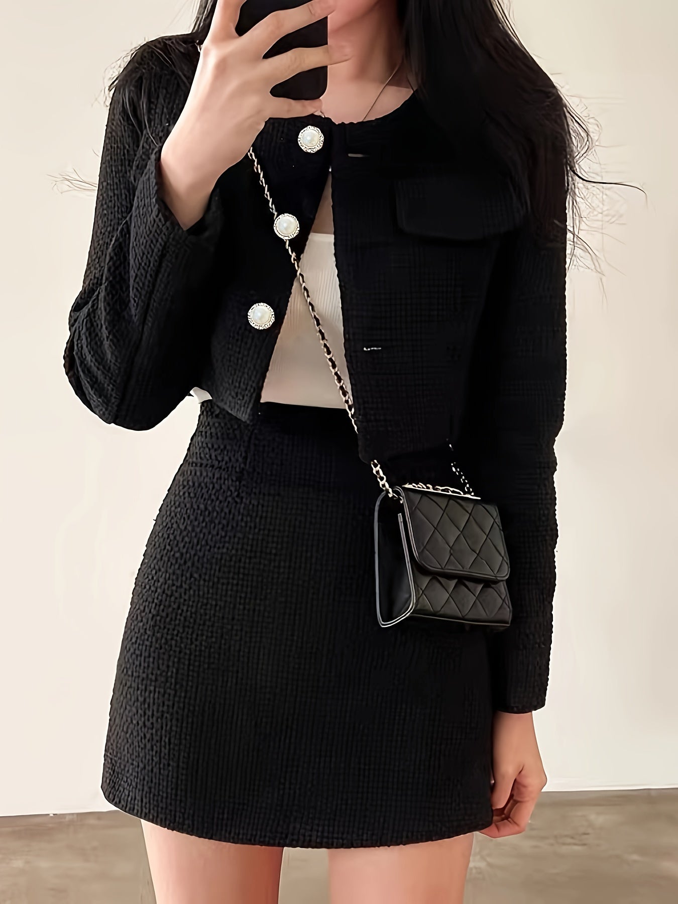 Thick tweed jacket and A-line skirt with round neck and long sleeves