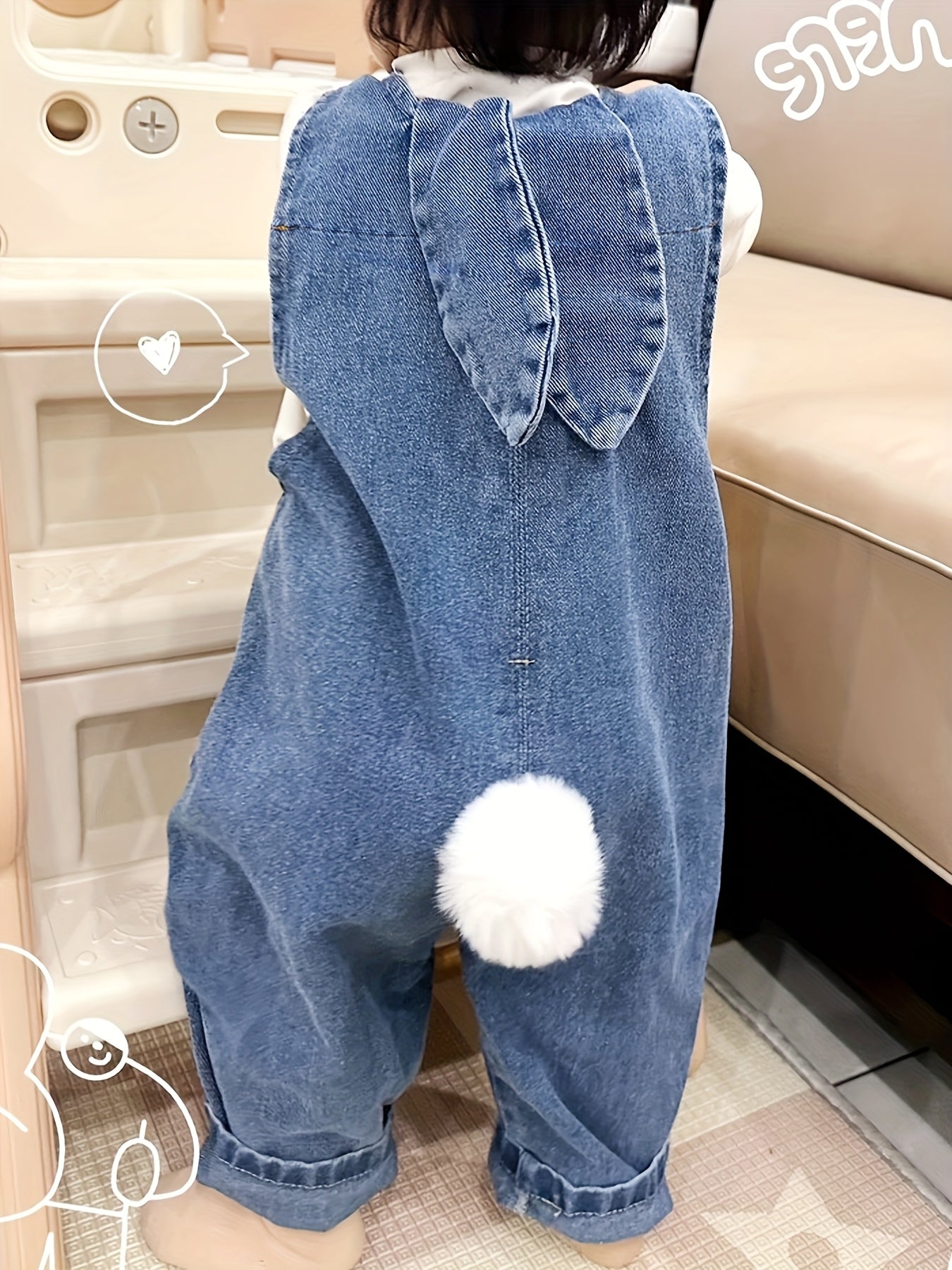 Adorable light blue denim overalls for kids with rabbit ear details. Casual, loose fit for spring & autumn. Machine washable, perfect for outdoor activities.