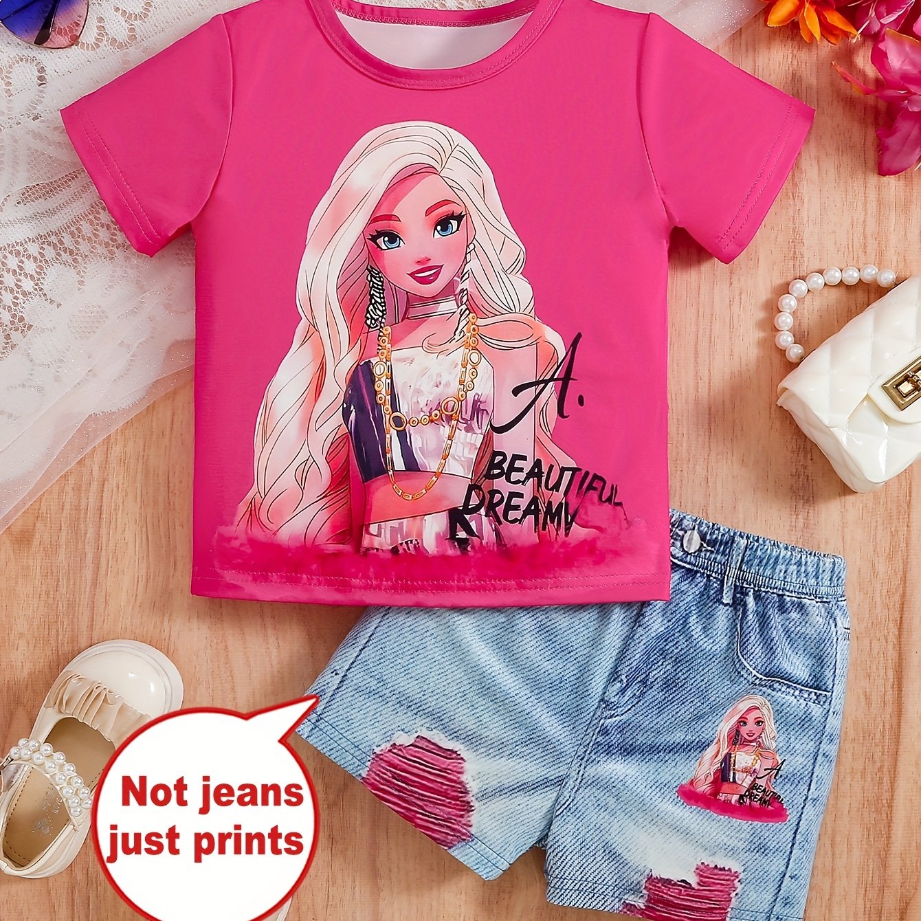 Cartoon print girls' short sleeve top and graphic shorts set, perfect for outdoor summer activities