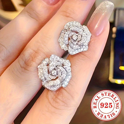 These stunning stud earrings are crafted from 4.4g of 925 sterling silver and feature synthetic zirconia stones. The elegant rose flower design exudes luxury and sophistication, making them a perfect accessory for daily wear or special occasions like