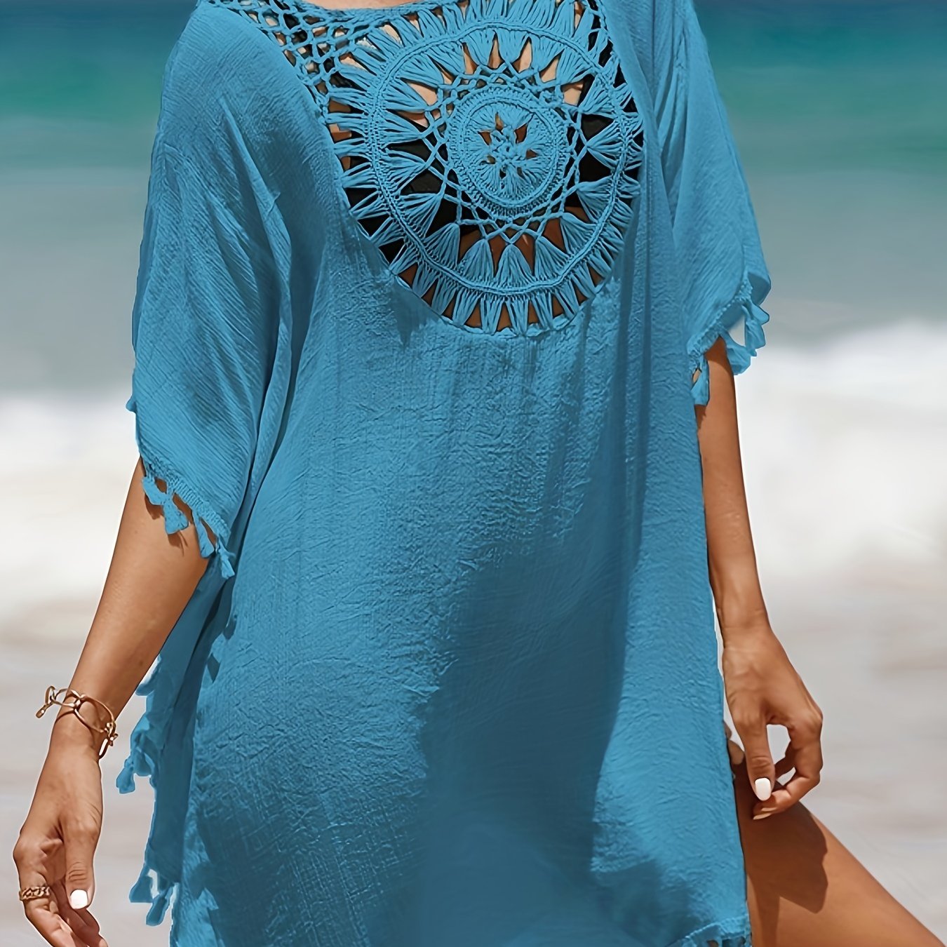 Women's casual beach vacation sunscreen shirt with solid-colored fabric spliced with small tassels for a sexy cover-up style.