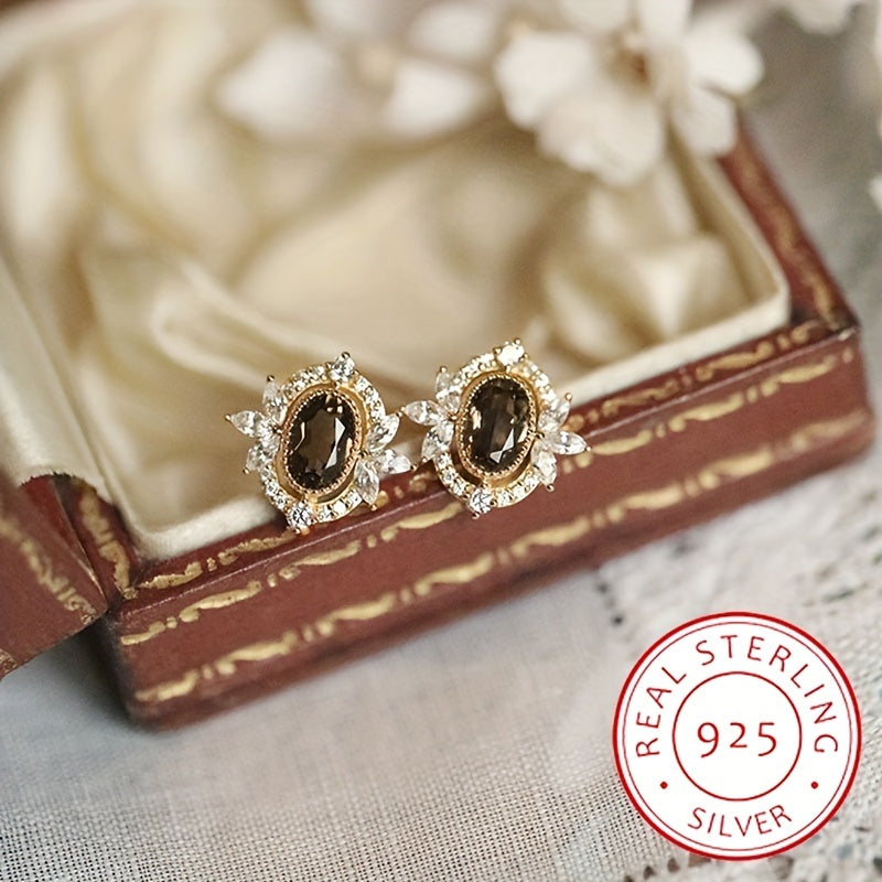 Elegant style banquet ear ornaments featuring hypoallergenic sterling 925 silver stud earrings adorned with brown oval zirconia decor.