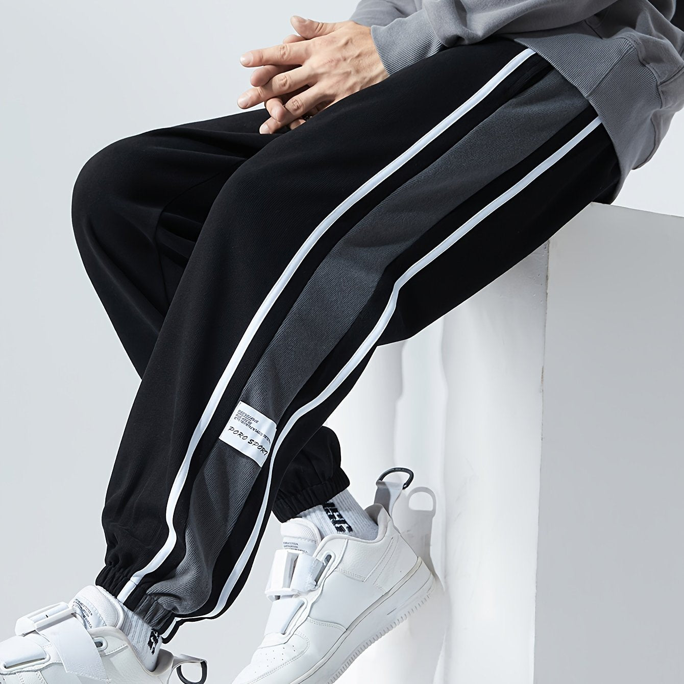 Men's loose sports pants for summer and fall, trendy style, available in large sizes, suitable for casual wear.