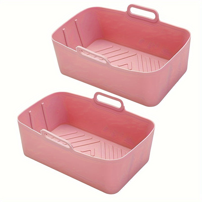 Two food-grade silicone air fryer liner trays, rectangular oven mats for baking pans, perfect for flat bottom pots. They are easy to clean, reusable, and resistant to high temperatures. These non-stick baking pans are an essential addition to your