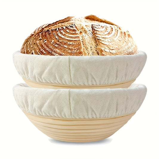 Set of two modern round bread proofing baskets with liners made from rattan. This banneton basket kit is ideal for baking artisan sourdough bread, providing a non-stick fermentation basket for home bakers and bread making.